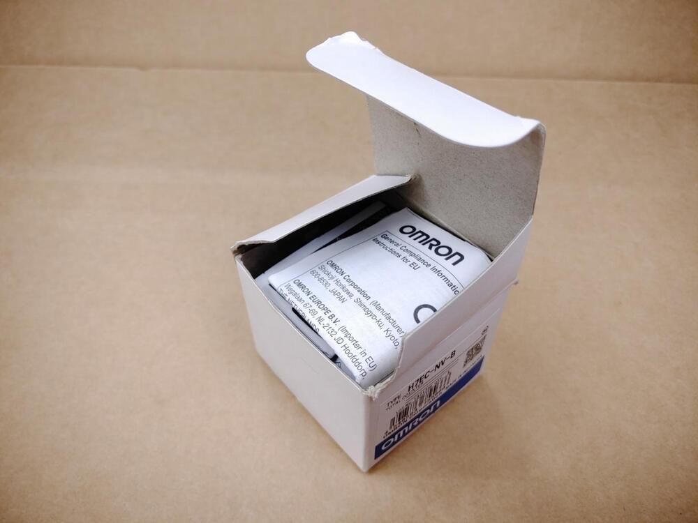 Omron H7EC-NV-B total counter in its packaging, white box with label, including "OMRON" text and compliance information.