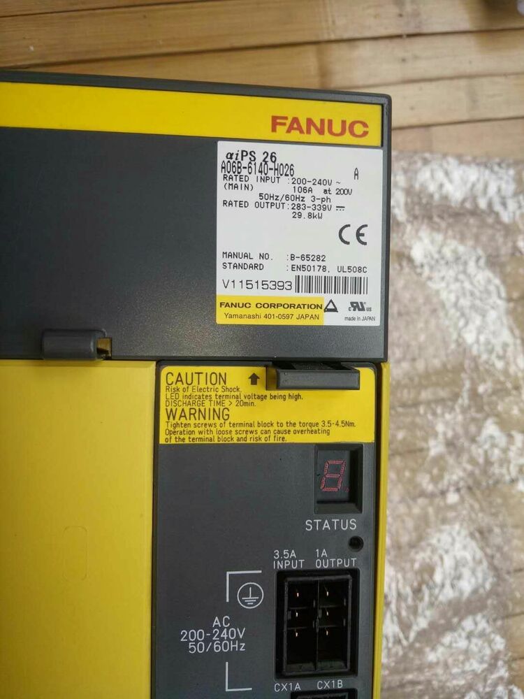 FANUC A06B-6140-H026 Servo Drive. Shows model, input/output, warnings. For industrial automation.