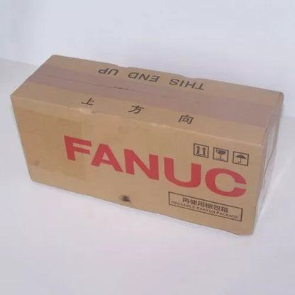 FANUC A06B-0034-B175#0008 Servo Motor in box, brown carton with shipping labels. Reusable carton package.