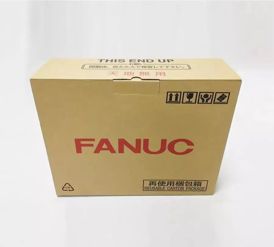 FANUC product packaging box, labeled with 'This End Up' and Japanese instructions, reusable carton