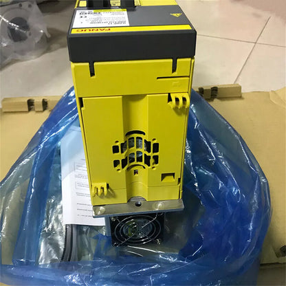 FANUC A06B-6112-H011#H550 Servo Drive in packaging. Yellow and black industrial equipment.