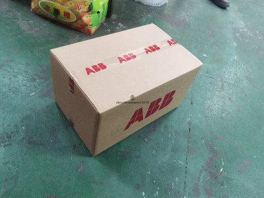 ABB PLC module box, new industrial automation part, cardboard packaging.