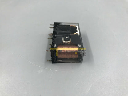 Omron G7SA-2A2B safety relay. Clear plastic housing, black components, copper coil, industrial automation component.