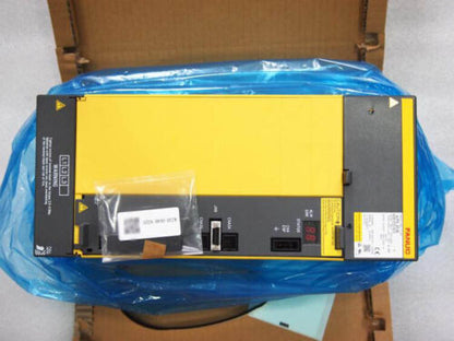 Fanuc A06B-6200-H030 Servo Amplifier in box, industrial automation part, yellow and black.