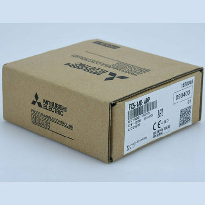 Mitsubishi FX5-4AD-ADP PLC Module box. Programmable Controller, MELSEC. Model and serial numbers are visible.