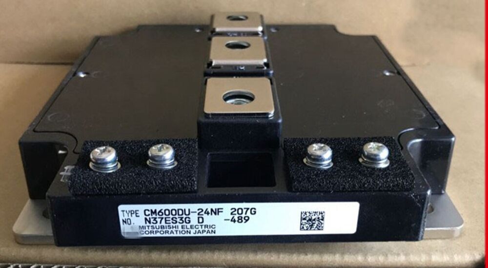 Mitsubishi CM600DU-24NF IGBT Module, new in box, featuring a label with product information.