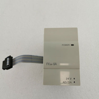 Mitsubishi FX2N-5A PLC Module with power indicator and connector.