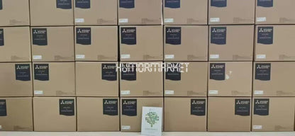 Mitsubishi MDS-D-V2-4040 servo driver boxes, stacked. Industrial automation parts.