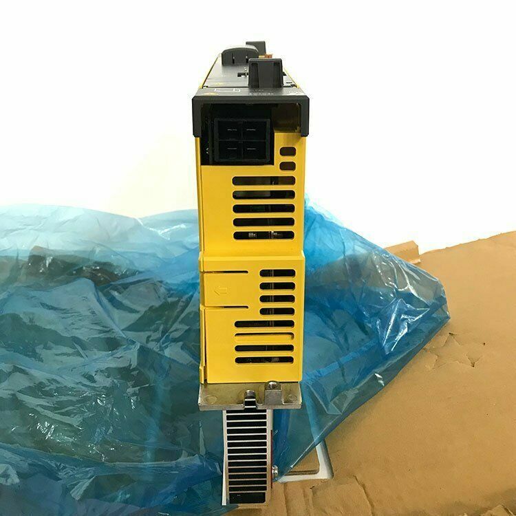 FANUC A06B-6117-H106 Servo Drive, yellow industrial component with cooling fins, new in box.