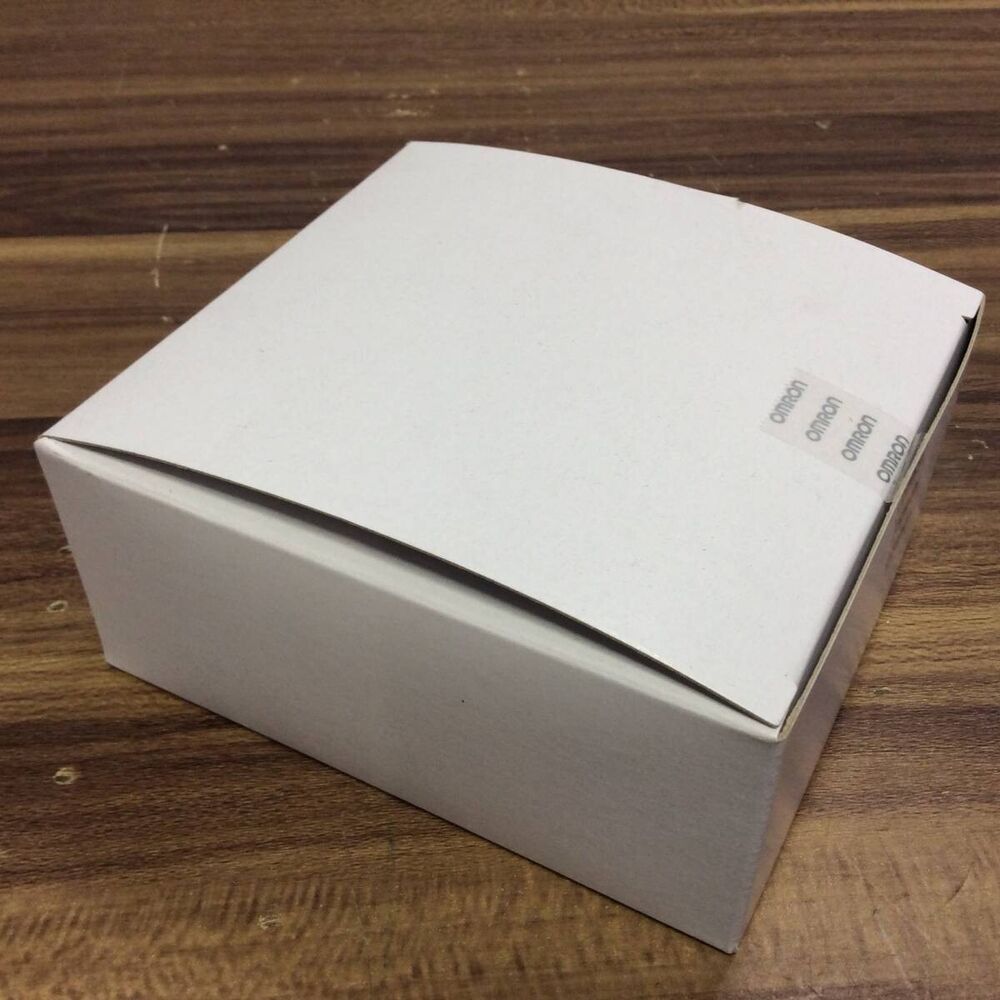 OMRON NX-SL3300 Safety CPU Unit box, sealed with brand stickers, on wooden surface