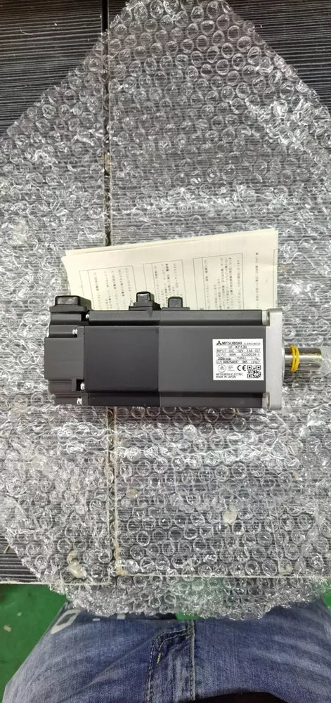 Mitsubishi HF-MP43B AC Servo Motor in protective packaging, industrial automation part.