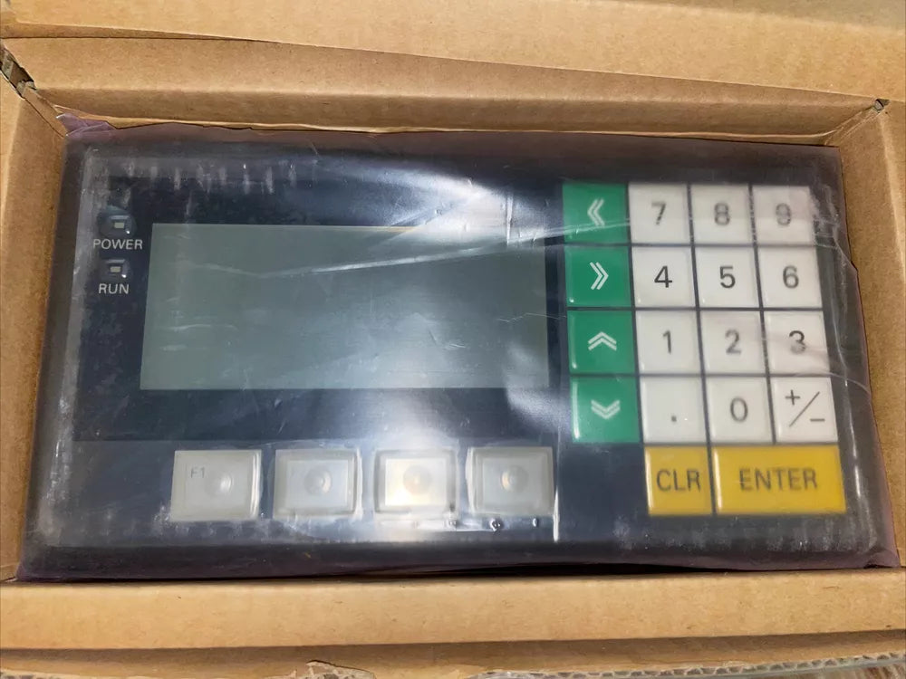 Omron NT11S-SF121B Touch Panel HMI. Numeric keypad, function buttons, and LCD screen for industrial use.