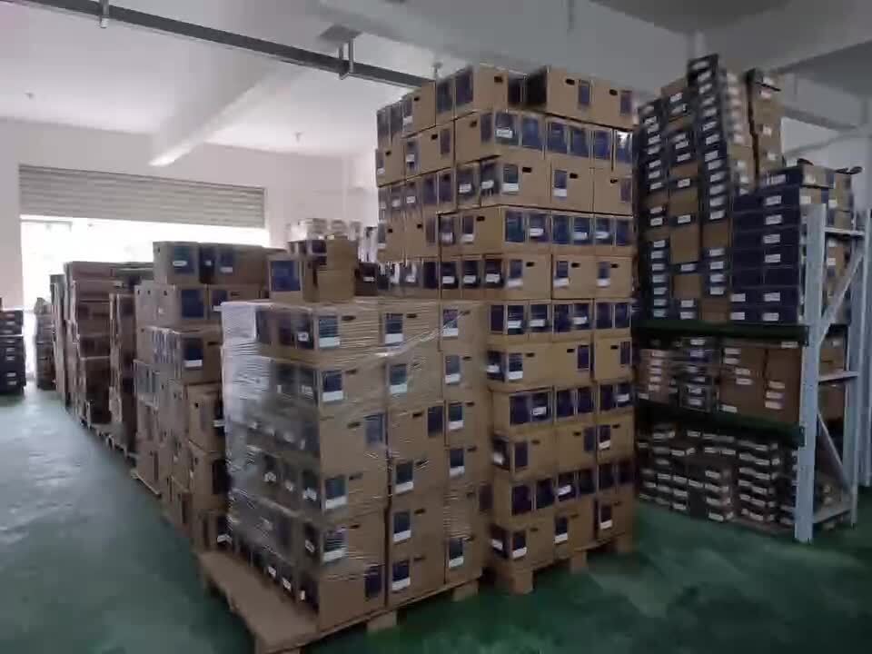 Large inventory of Mitsubishi MR-J4W2-22B AC Servo Drive boxes in a warehouse, ready for shipping.