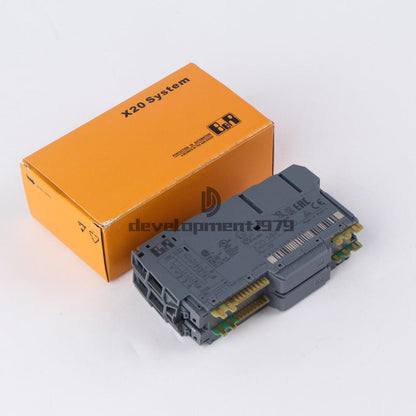 B&R X20 System PLC Module X20 MM 2436, gray industrial automation part in orange box, from Radwell