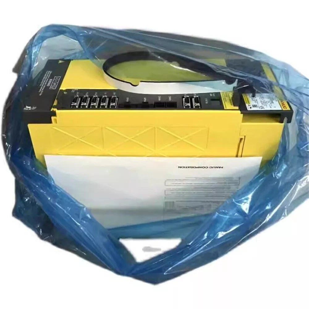 New FANUC A06B-6220-H030#H600 Servo Drive, yellow and black, in protective blue packaging. Includes product documentation.