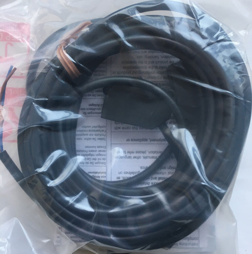 Omron E3Z-T81K photoelectric sensor cable assembly, black, in packaging.