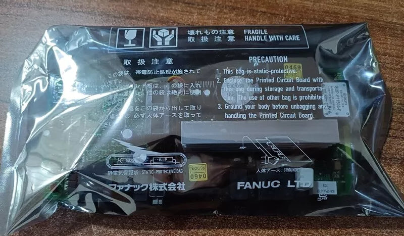 FANUC A20B-2101-0390 Control Board in static-protective bag, fragile packaging for PLC components.