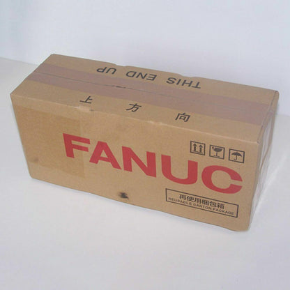 FANUC servo motor product packaging box, with "FANUC" logo and shipping labels, cardboard box.