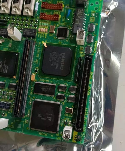 FANUC A20B-8100-0669 circuit board, green PCB with various components, Made in Japan, for industrial automation.