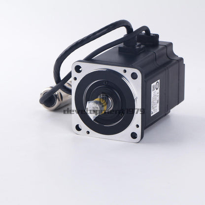YASKAWA AC Servo Motor SGMEV-04ADA6C. Black and silver industrial motor with attached cables,  product view.
