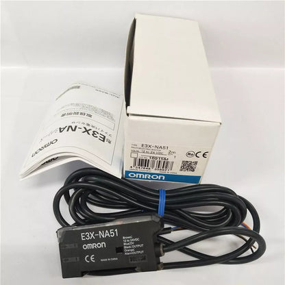 Omron E3X-NA51 photoelectric sensor, black cable, white box, and documentation. New Omron sensor for industrial automation.