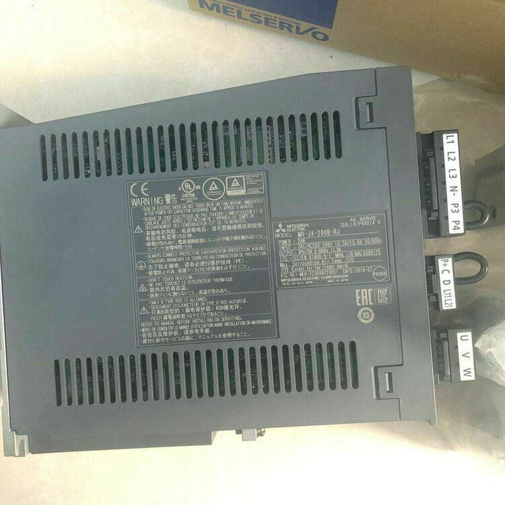 Mitsubishi MR-J4-200B-RJ Servo Drive. Industrial automation part with warning labels and connectors.