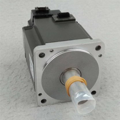 Mitsubishi HF-KE73KW1-S100 AC servo motor, industrial automation part, silver body with black top.