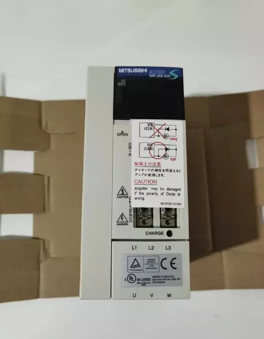 Mitsubishi MR-J2S-40A Servo Drive, white and black, industrial automation part, with warning labels and diagrams