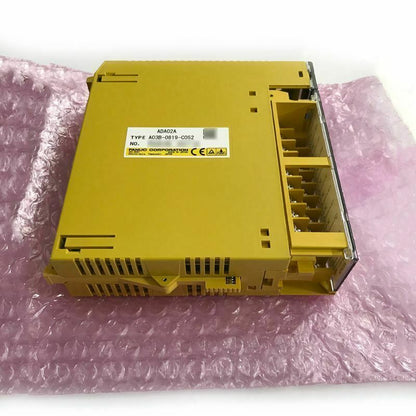 FANUC A03B-0819-C052 I/O Output Module. Yellow industrial automation component, new condition. Fast shipping available.