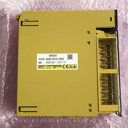 FANUC A03B-0819-C052 I/O Module, yellow industrial automation part, model details visible, fast shipping.