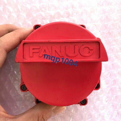 FANUC industrial automation part, red round component with mqp1004 marking, PLC part