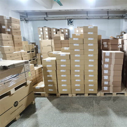 Warehouse storage of ABB ACS380 frequency converters on pallets, ready for shipping.