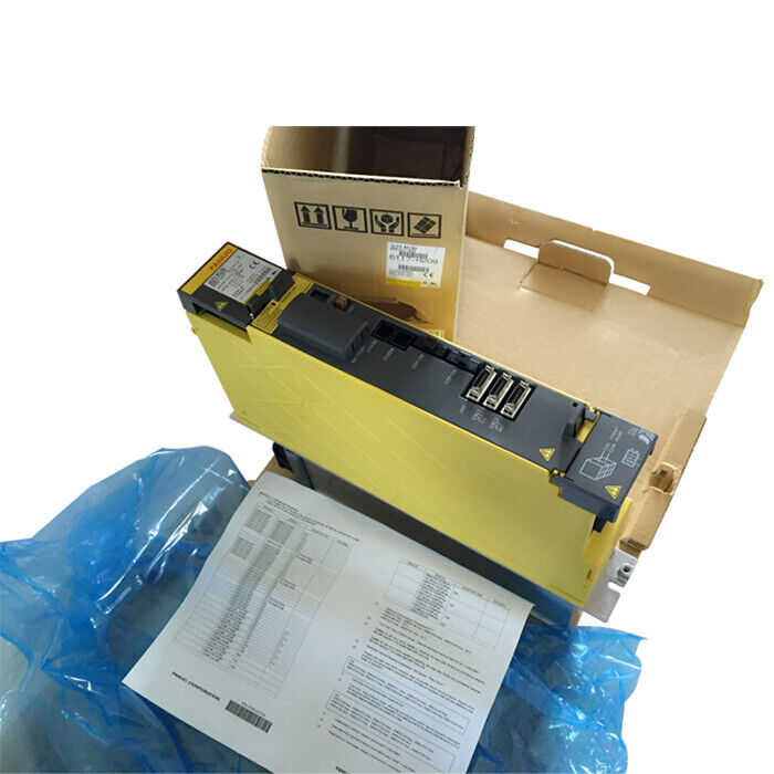 FANUC A06B-6114-H210 servo drive unit in box, yellow industrial automation component