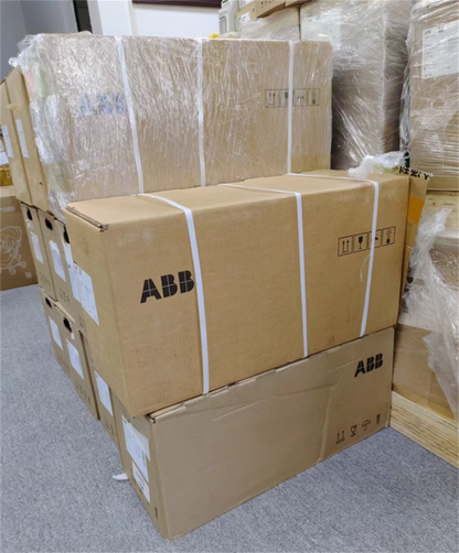 Stacked ABB ACS880-01-038A-3 inverter boxes, ready for shipment, brand logo visible on cardboard packaging.