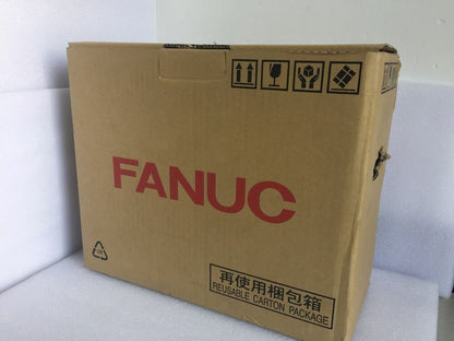 Fanuc product box, cardboard package with "FANUC" logo and handling instructions. Reusable carton package.