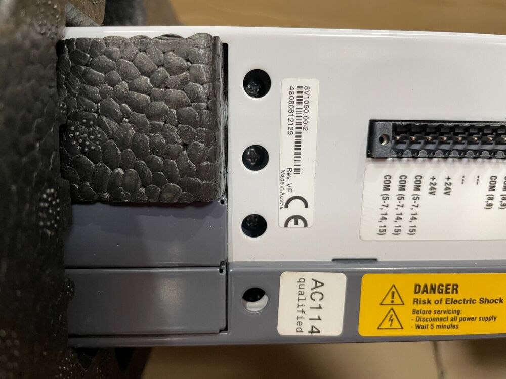 B&R ACOPOS servo drive detail, showing AC114 qualified, danger warning, and serial number.