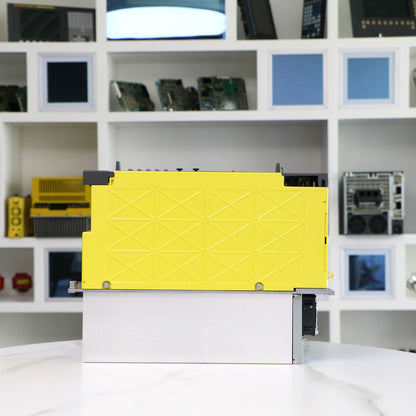 FANUC A06B-6220-H015#H600 Servo Drive Amplifier, yellow casing, white base, industrial automation part.