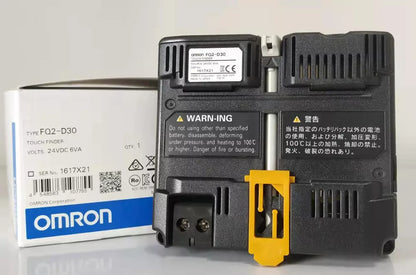 Omron FQ2-D30 vision sensor with packaging, featuring warning labels and technical specifications, industrial automation.