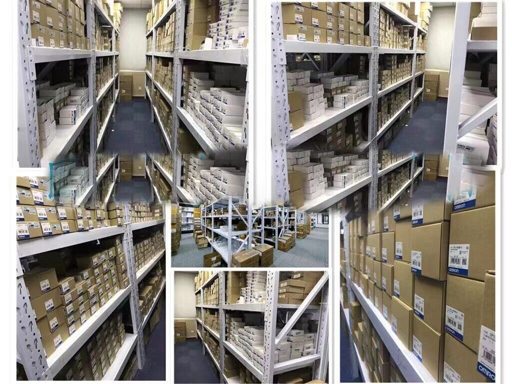 Warehouse stock of Omron CJ1W-CLK23 Controller Module boxes, ready for shipping. Industrial automation parts.