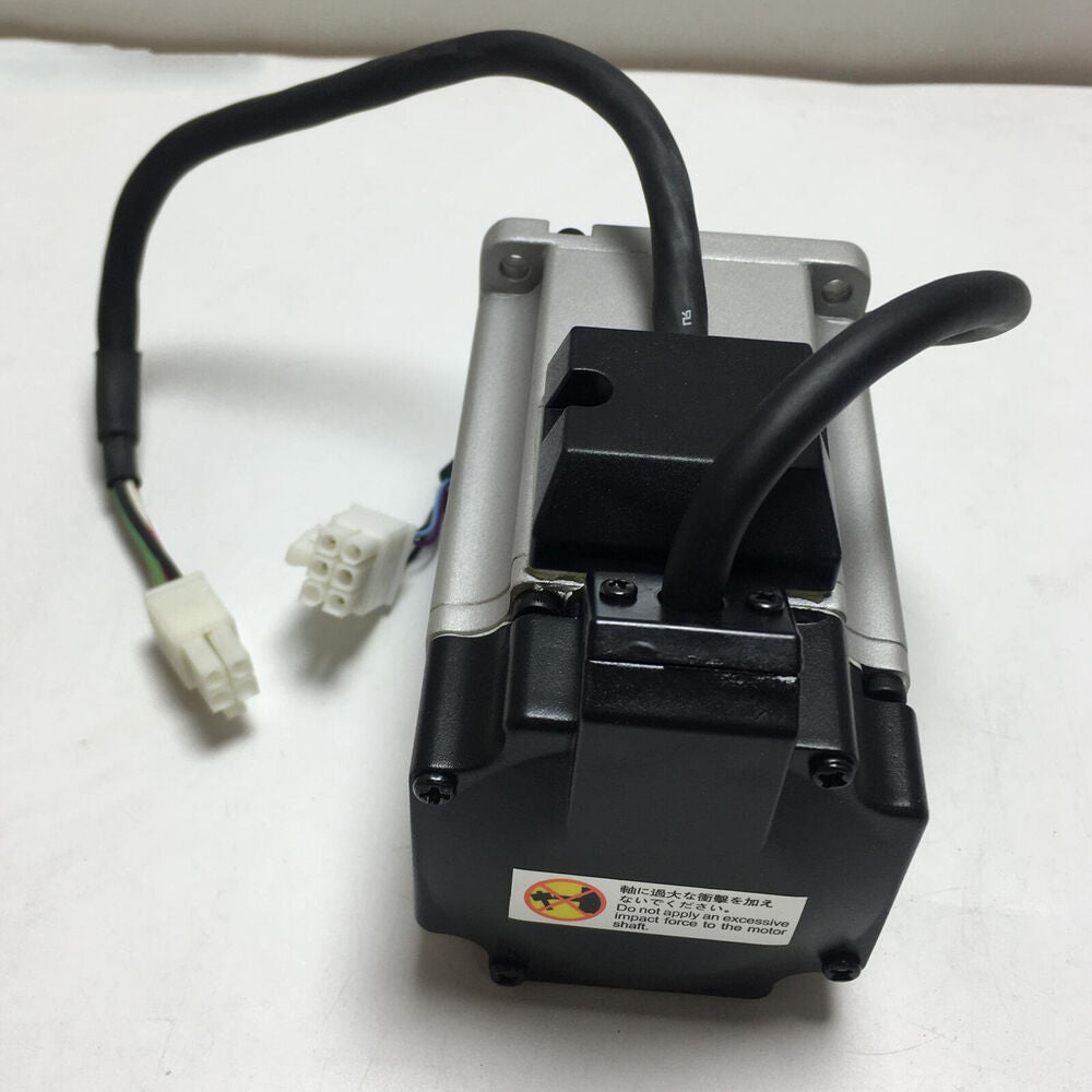 Omron R88M-G40030H-S2 servo motor. Silver and black, cables and connectors, industrial automation part. Warning label.