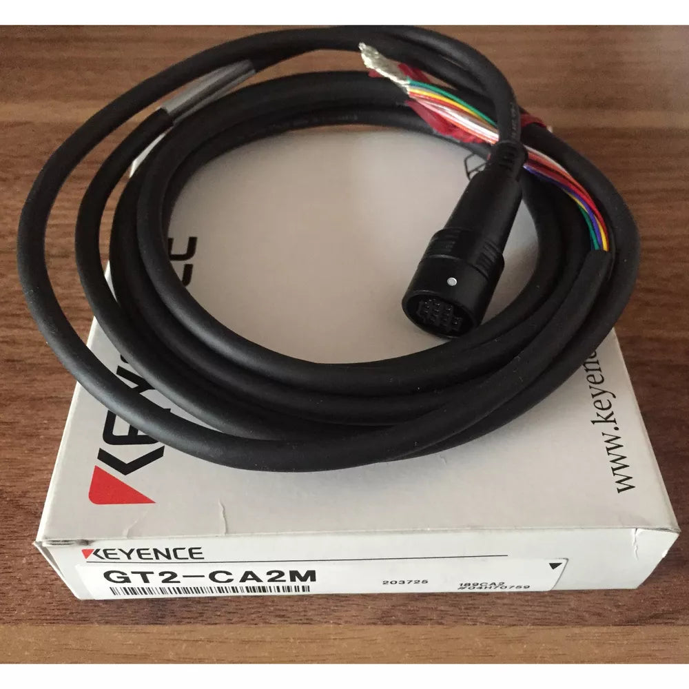 KEYENCE GT2-CA2M Laser Sensor Cable, black cable with connector, on product box