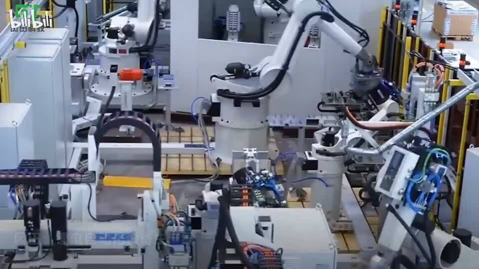 Automated industrial robot arms assembling PLC units, industrial automation