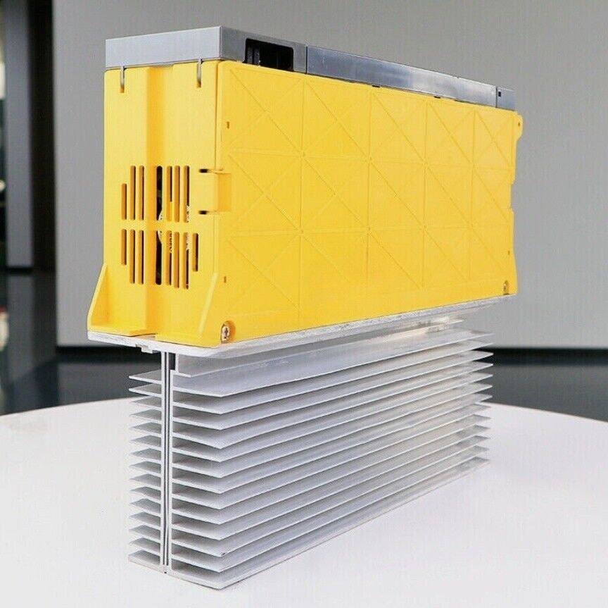 FANUC A06B-6077-H106 Servo Drive, yellow casing with silver heat sink, industrial automation part
