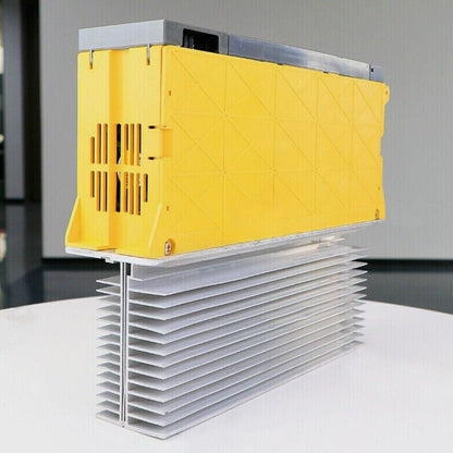 FANUC A06B-6077-H106 Servo Drive, yellow casing with silver heat sink, industrial automation part