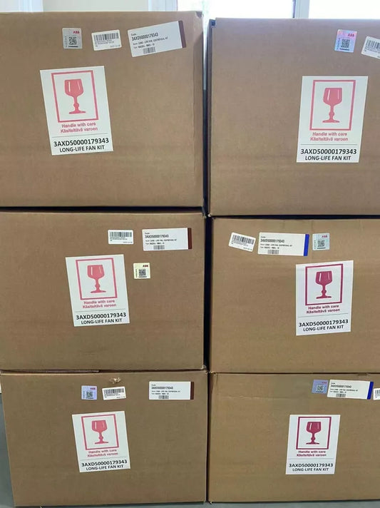 Stacked boxes of ABB ACS800 R3G355-RB03-10 fans, labeled with 'Handle with care' and product information.