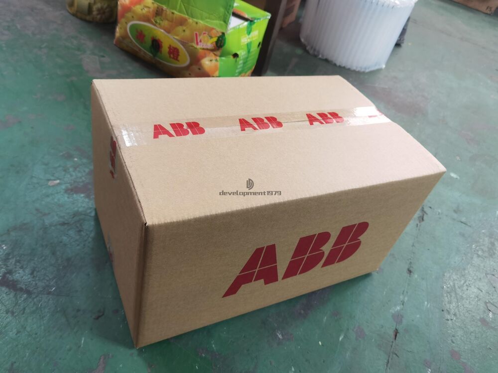 ABB PLC module shipping box, cardboard packaging with logo, new industrial automation parts.
