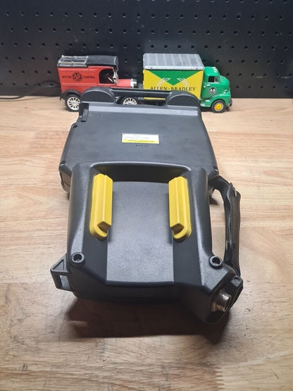 FANUC A05B-2255-C101#EMH Teach Pendant with Allen-Bradley and Motor Control toy trucks, industrial automation equipment.