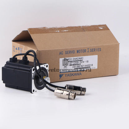 YASKAWA AC Servo Motor SGMEV-04ADA6C, packaged in a cardboard box.  Black and silver industrial motor with attached cables.