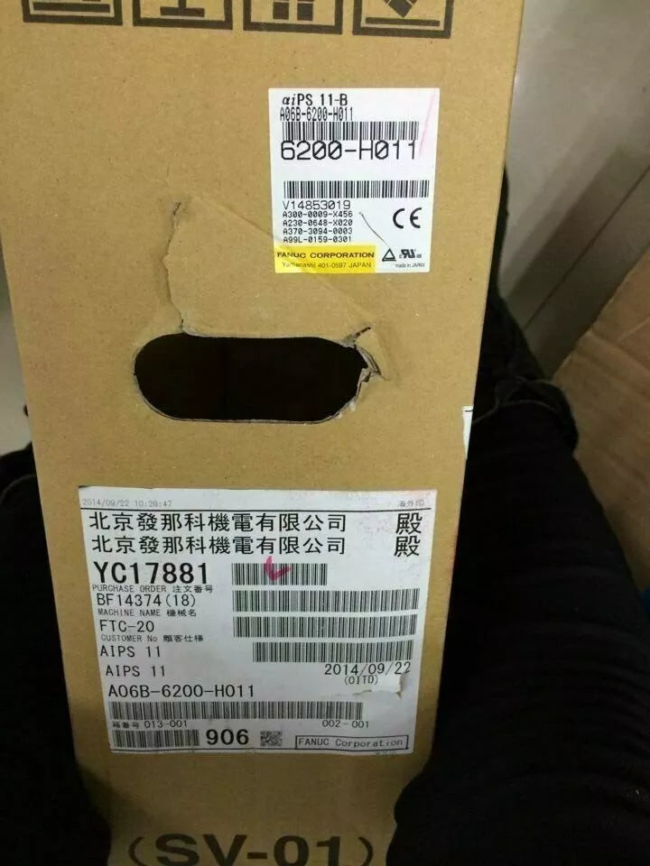 FANUC A06B-6200-H011 Servo Drive packaging with labels, part numbers, CE mark, from Radwell. Featuring FANUC and date.