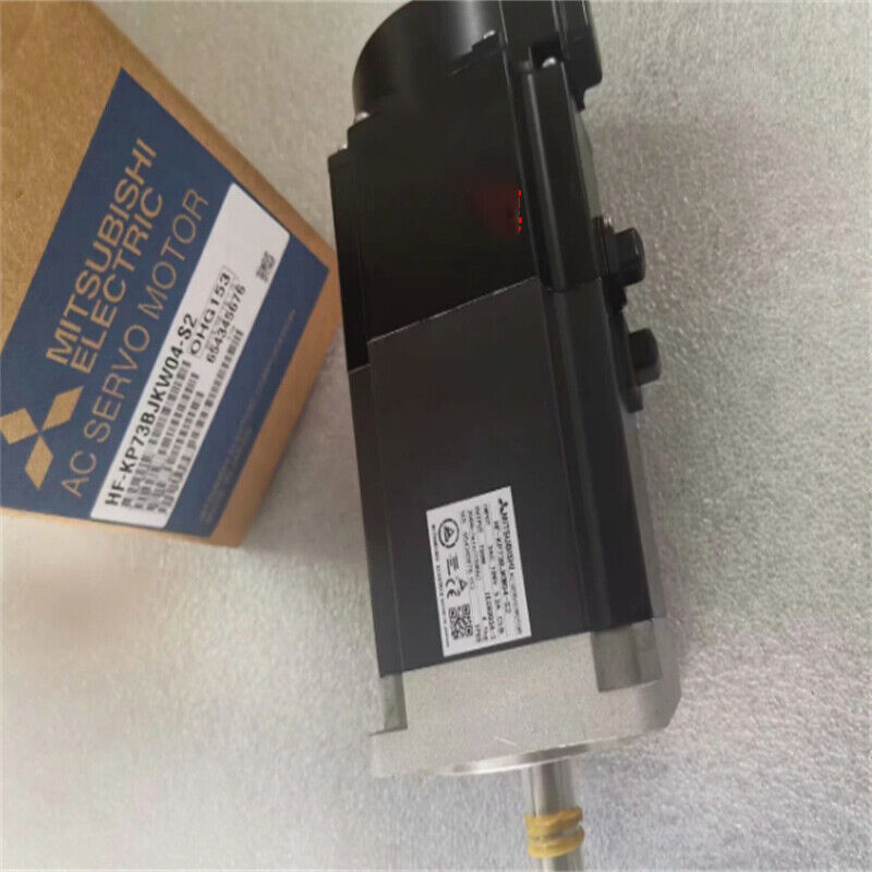 Mitsubishi HF-KP73BJKW04-S2 AC Servo Motor, black and silver, in box with product details.
